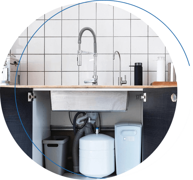 A kitchen with a sink and some water filters
