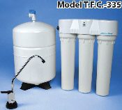 A water filter system with four filters and a tank.