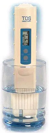 A blue and white remote control sitting in a clear container.