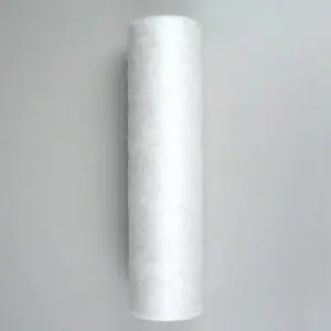 A white tube of thread on the wall.