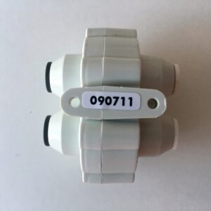 A white plastic object with a number on it.