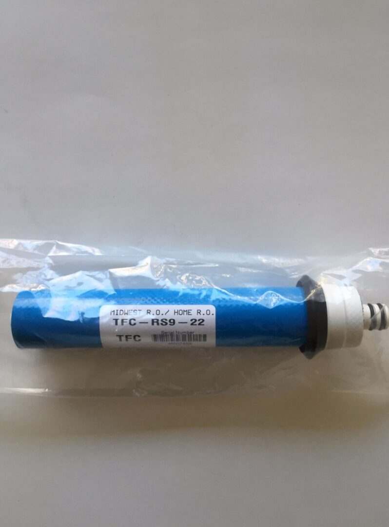 A blue tube with white writing on it.